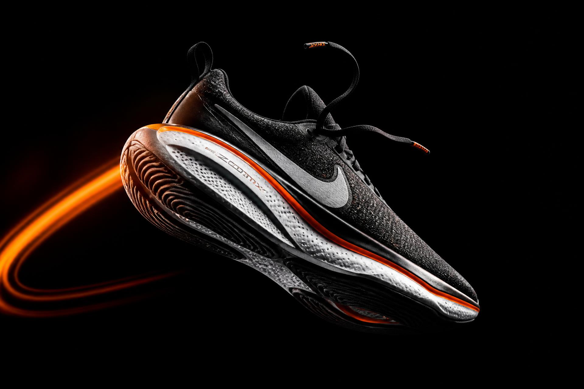 Quixel performance sneaker in mid-air with volt light trail